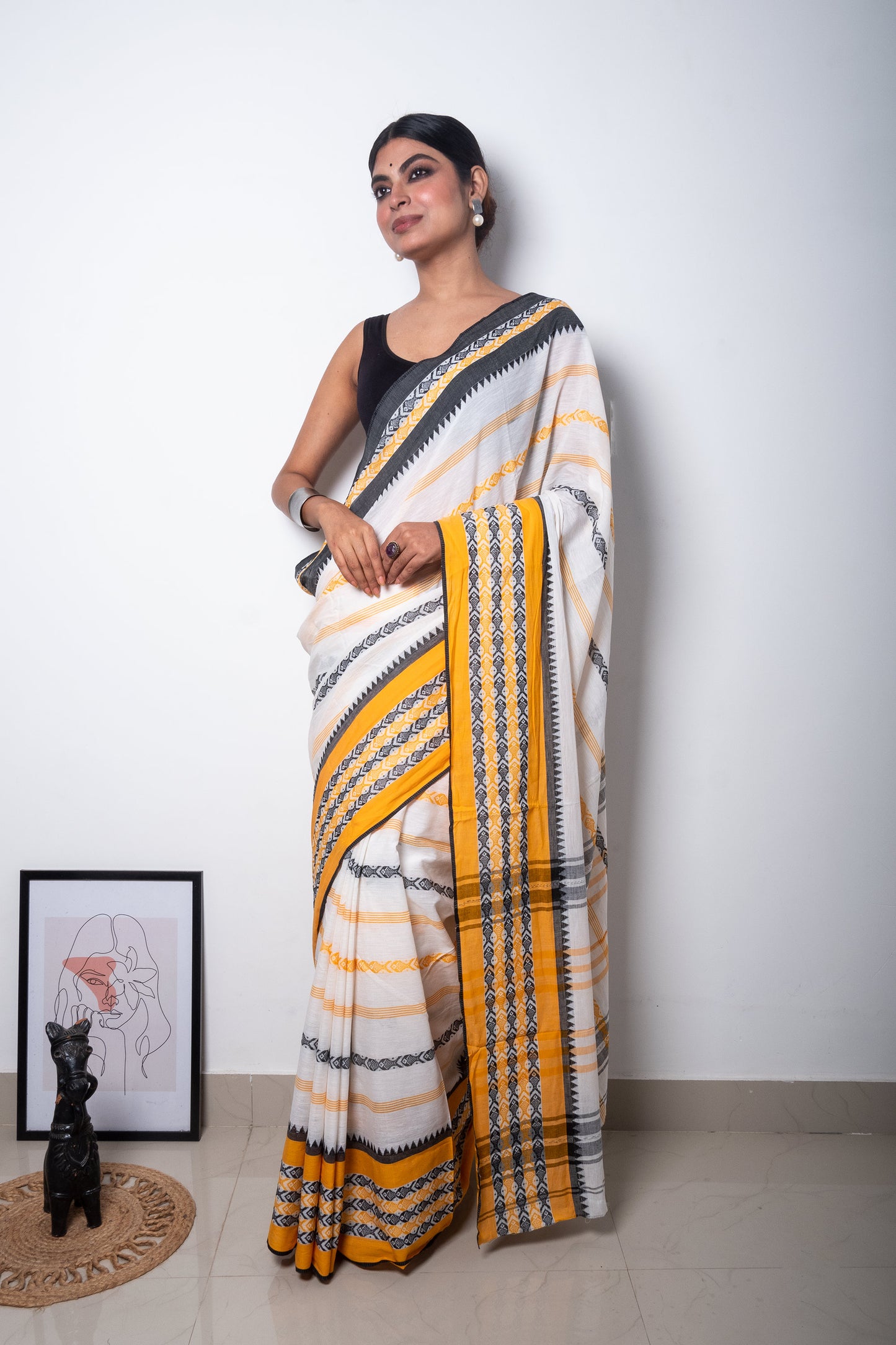 White Dhaniakhali Cotton Saree with Yellow-Black Fish Motifs woven Border