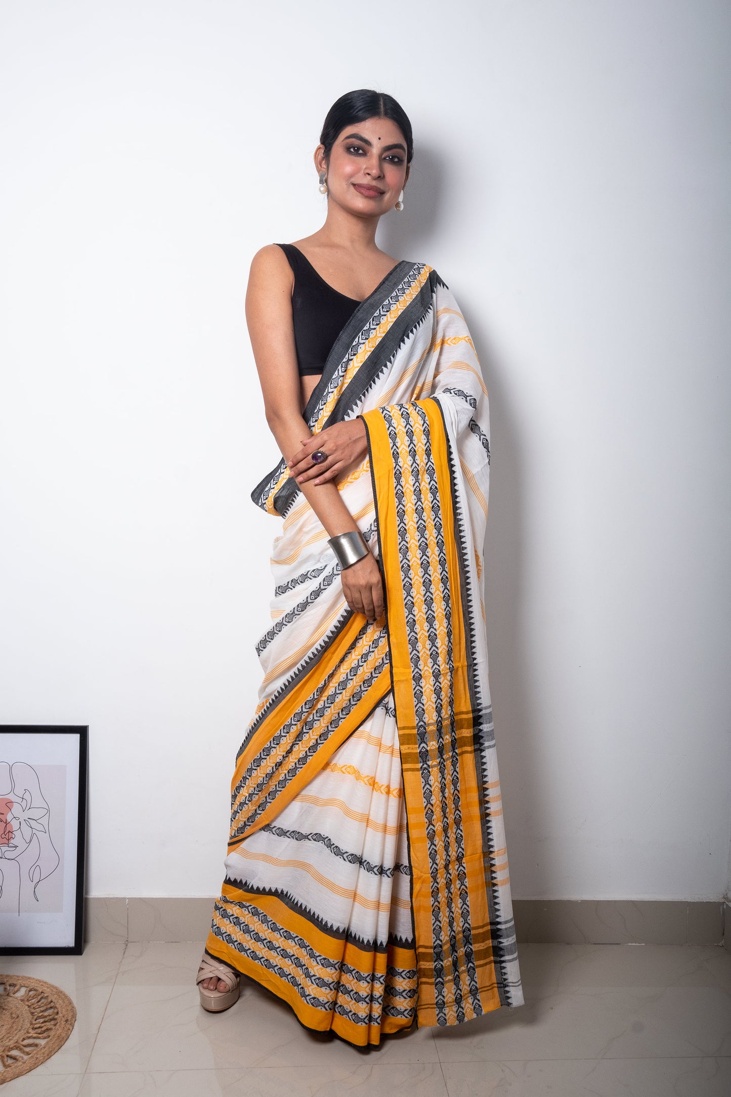 White Dhaniakhali Cotton Saree with Yellow-Black Fish Motifs woven Border