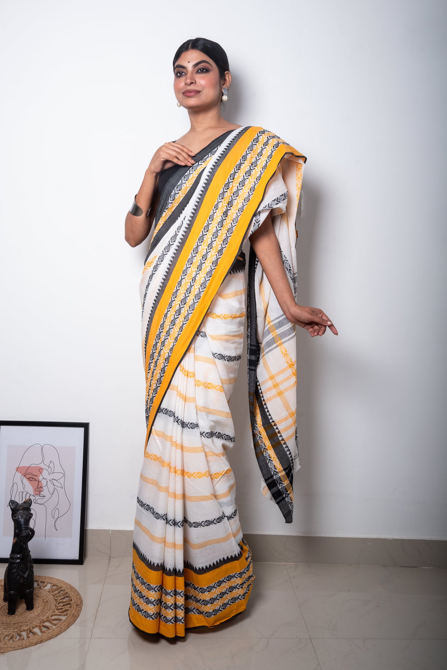 White Dhaniakhali Cotton Saree with Yellow-Black Fish Motifs woven Border