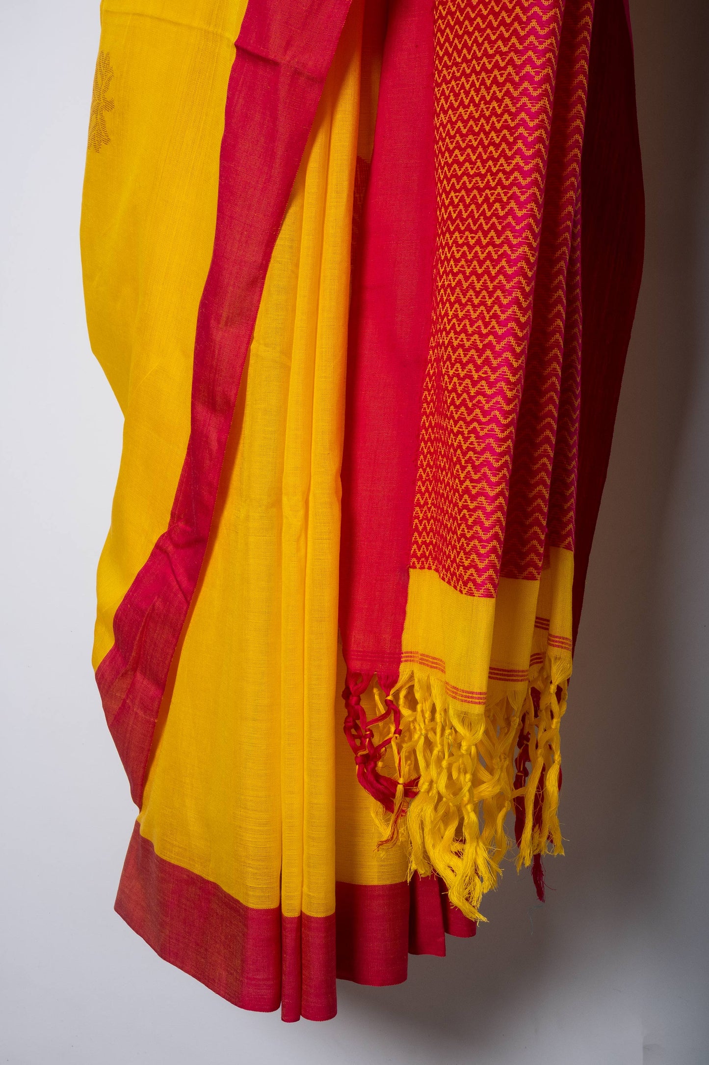 Yellow Handwoven Red Border Saree with Red and Rose Gold Leaf Motifs