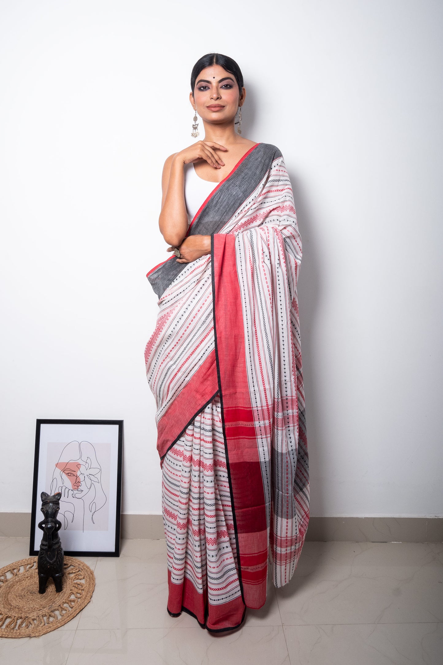 White Dhaniakhali Cotton Saree with Red Black Zigzag Woven patterns with Ganga Jamuna Borders