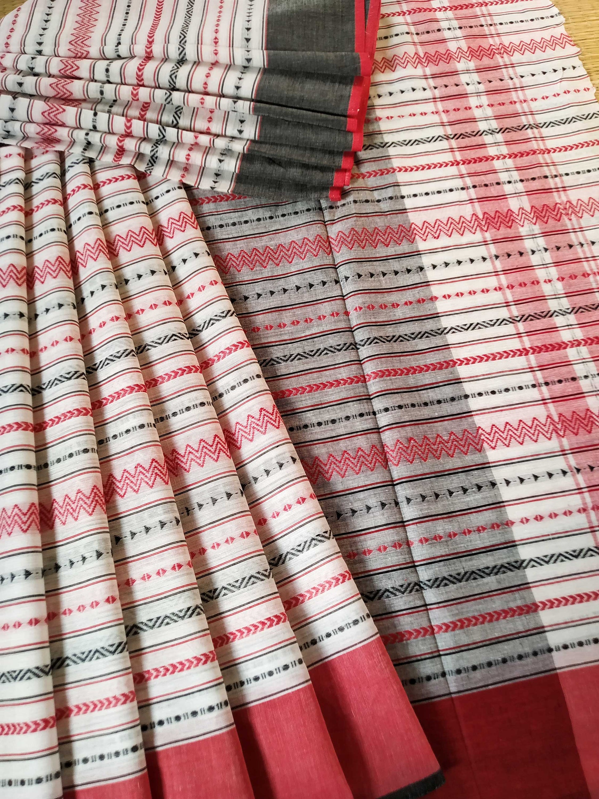 Buy White Dhaniakhali Cotton Saree with Red Zigzag Weave and Ganga Jamuna Borders- Mayasha